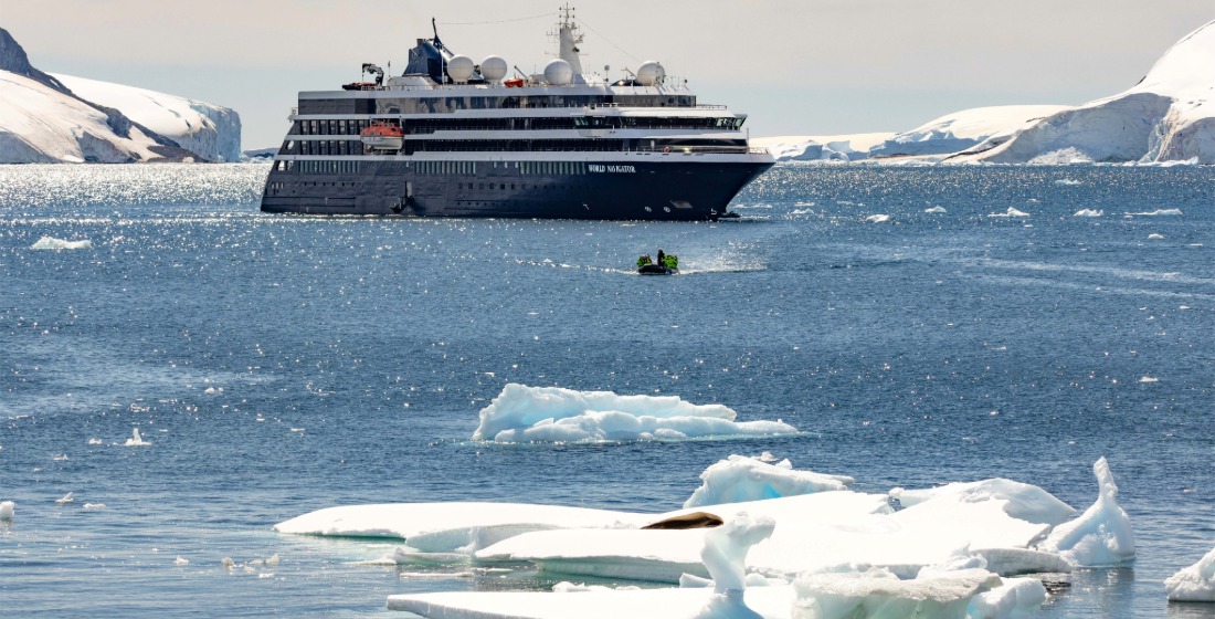 Atlas Ocean Voyages' yacht sailing in Antarctica amid ice floes