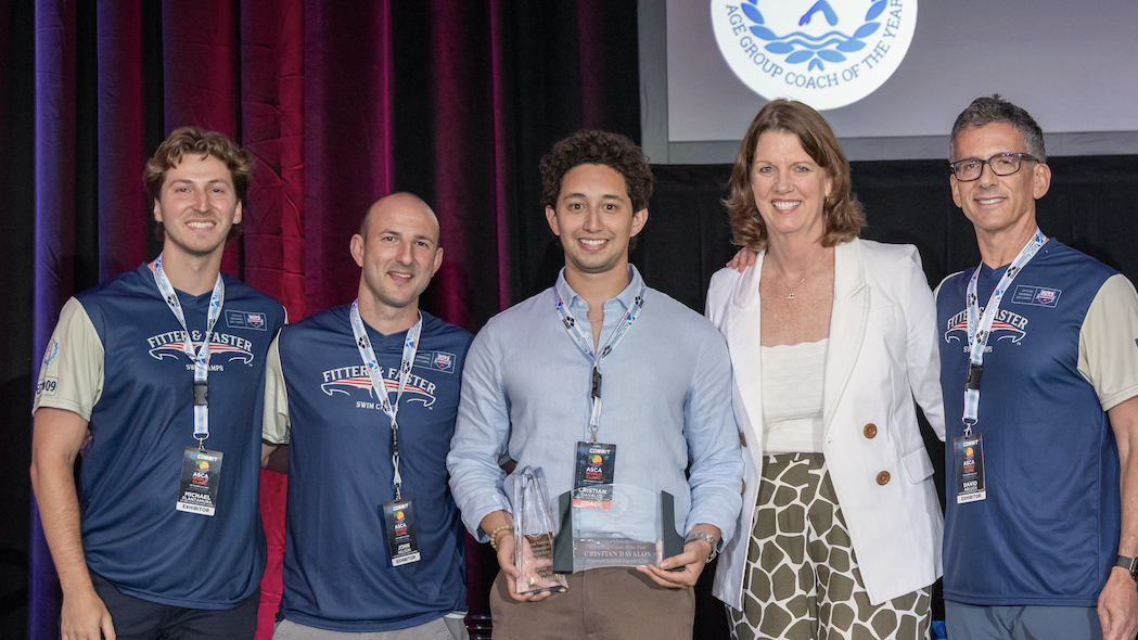 Cristian Davalos receiving his 2026 Age Group Coach of the Year Award