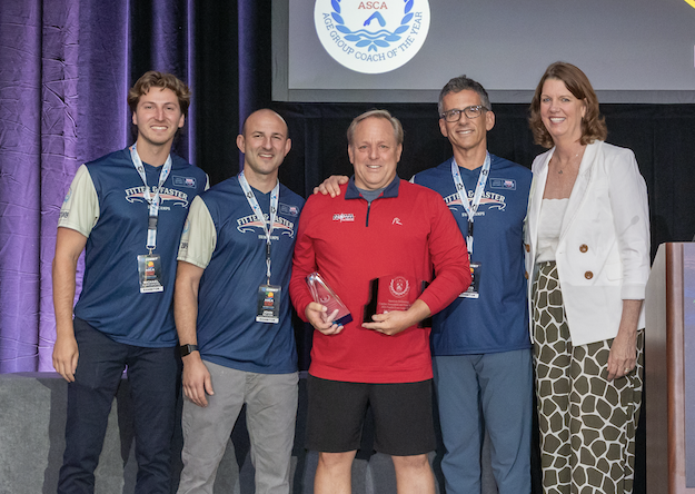 David Schreck receiving the 2026 Extra-Large Team Age Group Coach of the Year Award