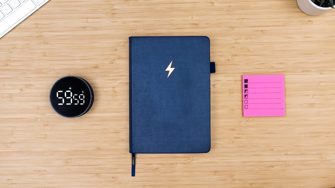 an image of a notebook with a list of tasks and a pen