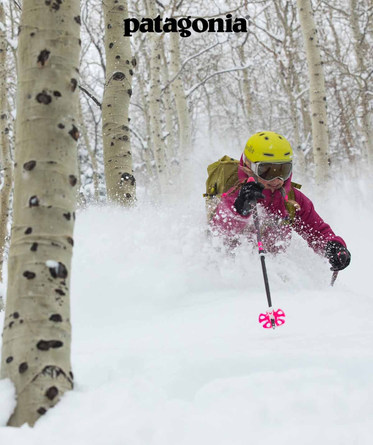 Patagonia. A person uses a long tool to open the roof vent in their yurt.