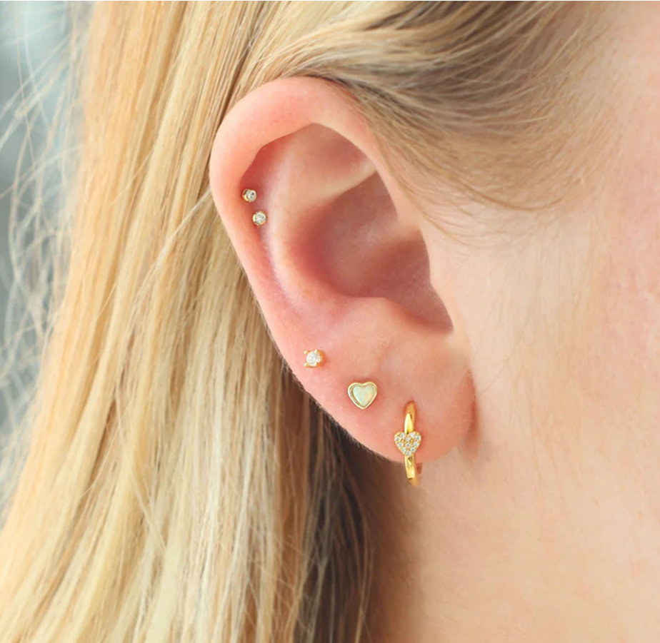 girl wearing stud earrings