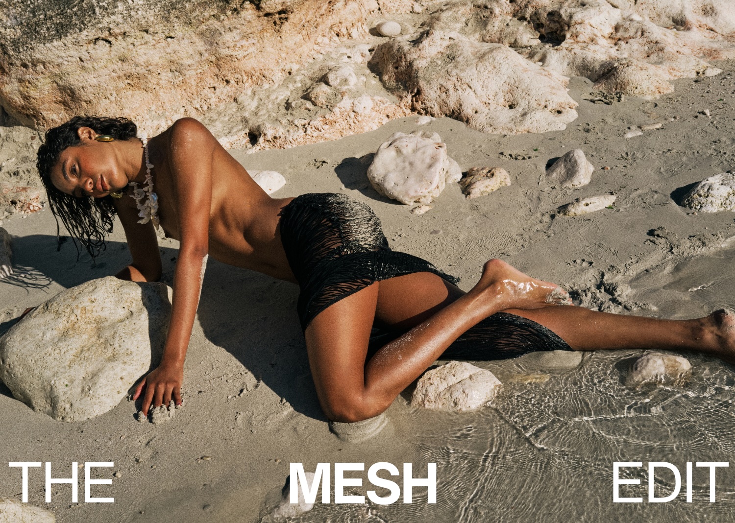 campaign image of a model at the beach