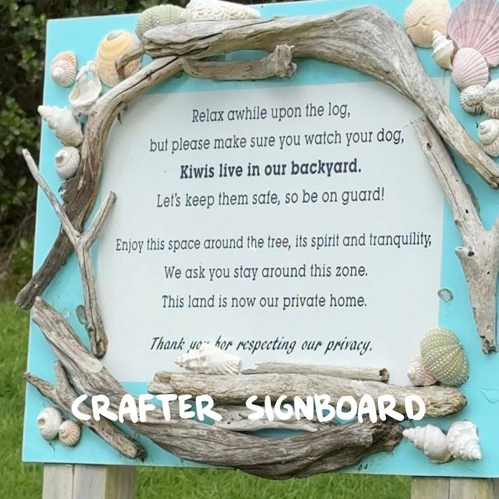 Beach sign decorated with driftwood and shells at Long Beach Russell