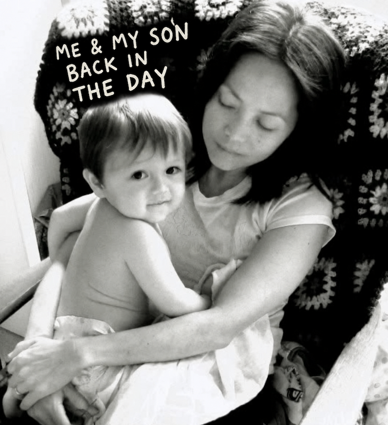 Rina holding her son as a baby