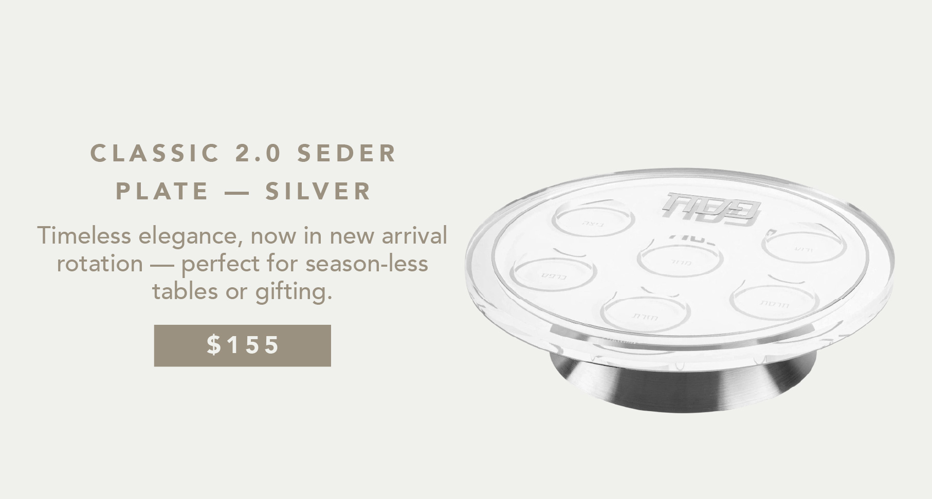 an image of a silver plate with a silver lid and a white background