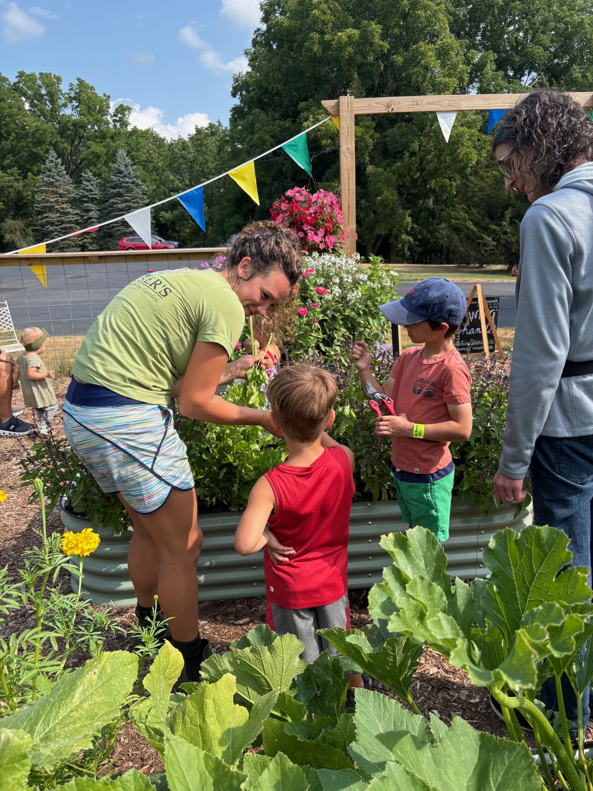 Caroline in the garden with some Grow Club kids