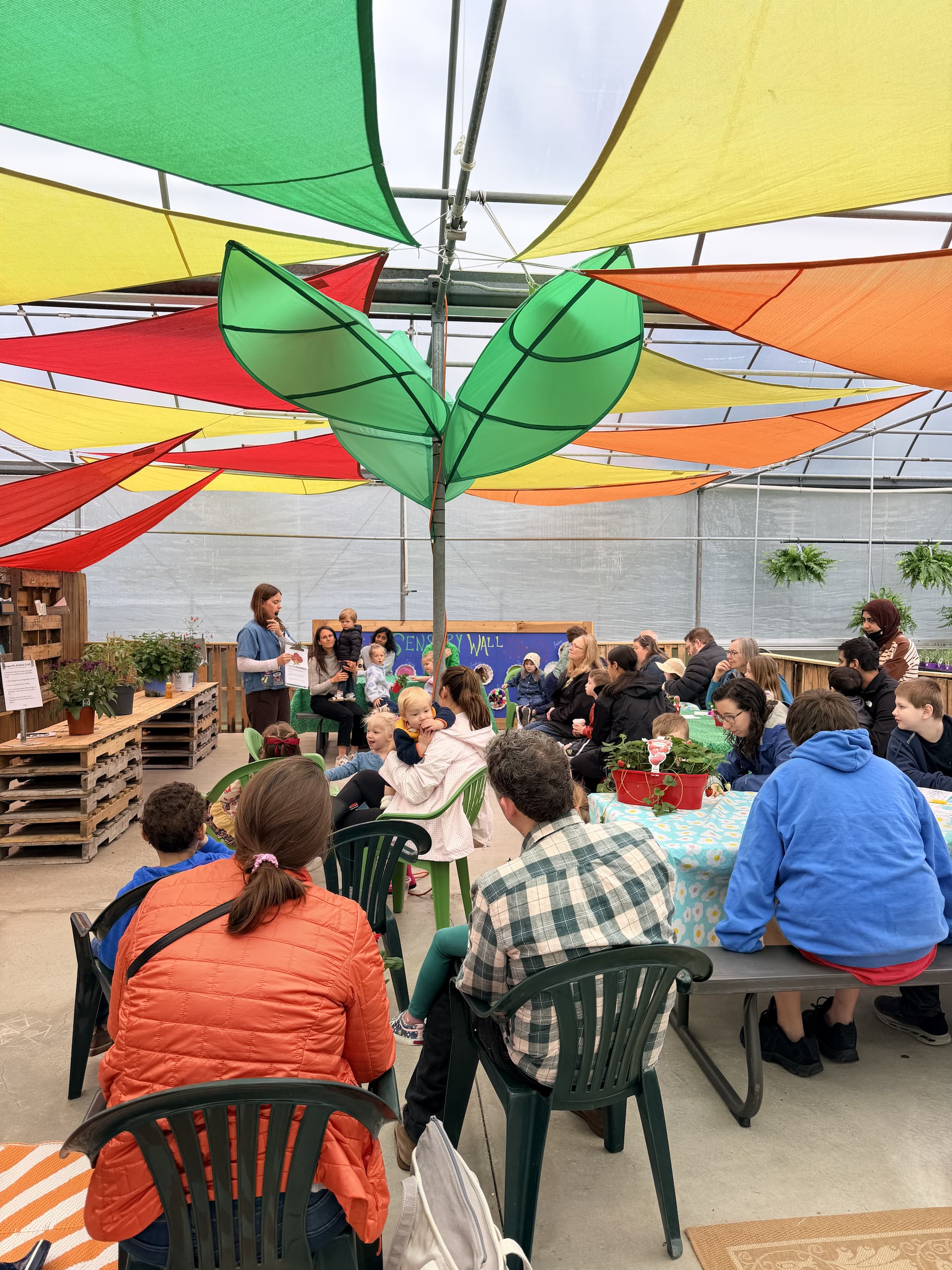 Families sitting in Grow Club area