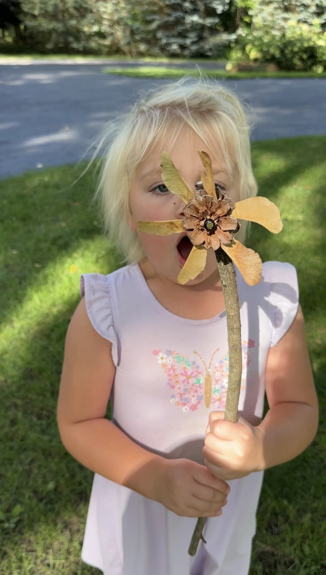 Little girl blowing the pinwheel