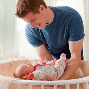 Baby being put to sleep by dad