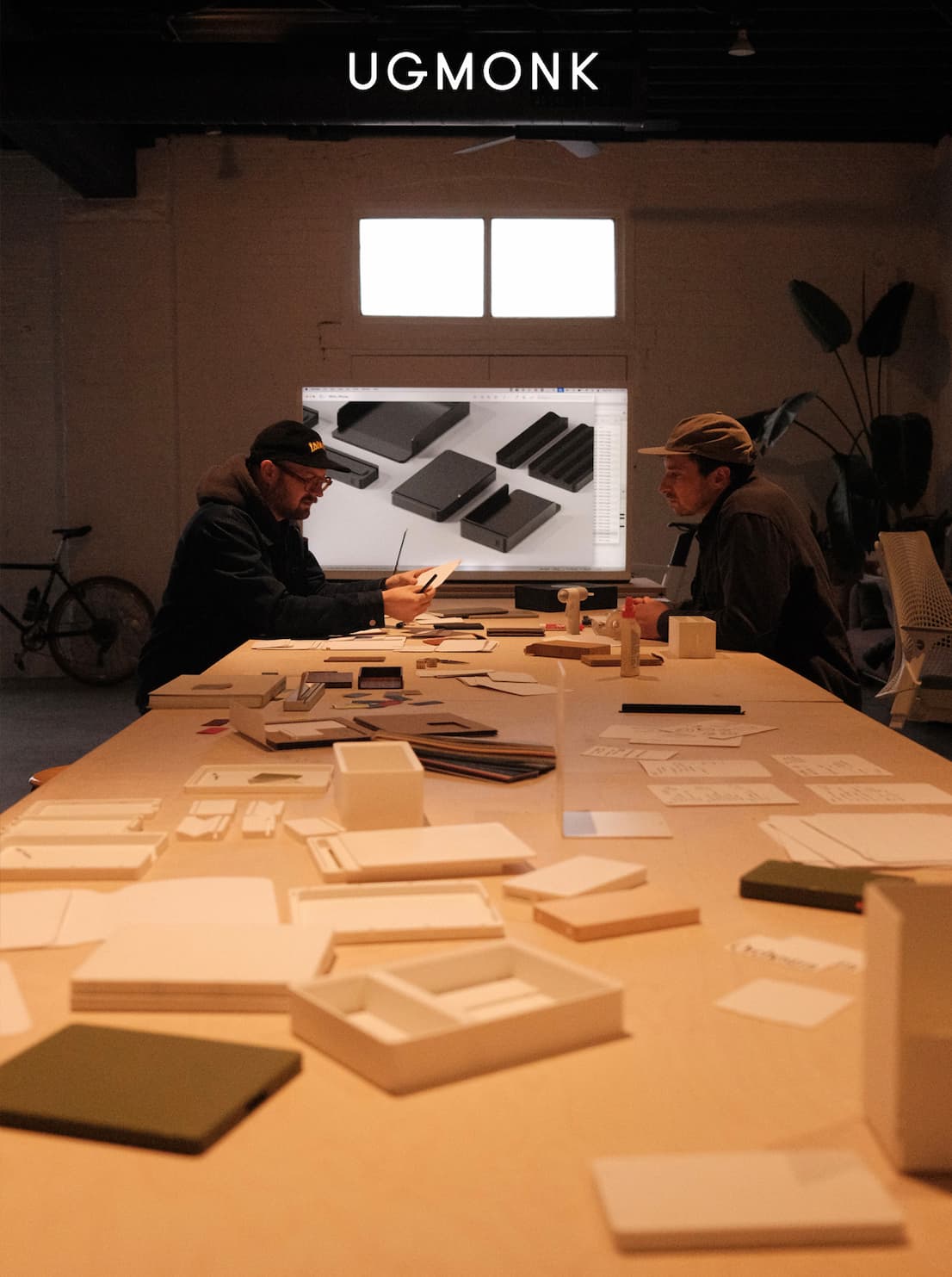 an image of a group of people sitting at a table with papers