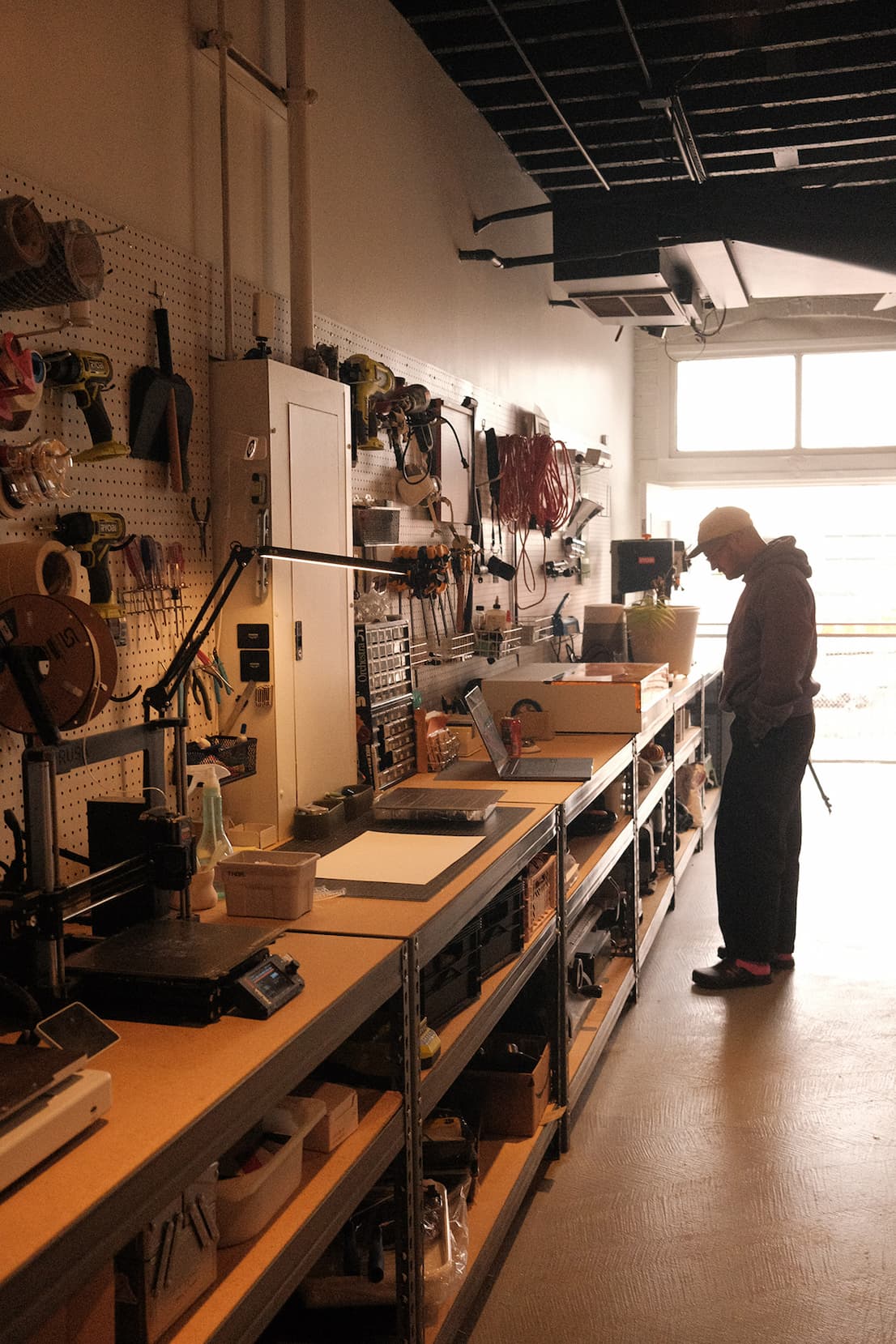 an image of a woman standing in a kitchen with a lot of tools