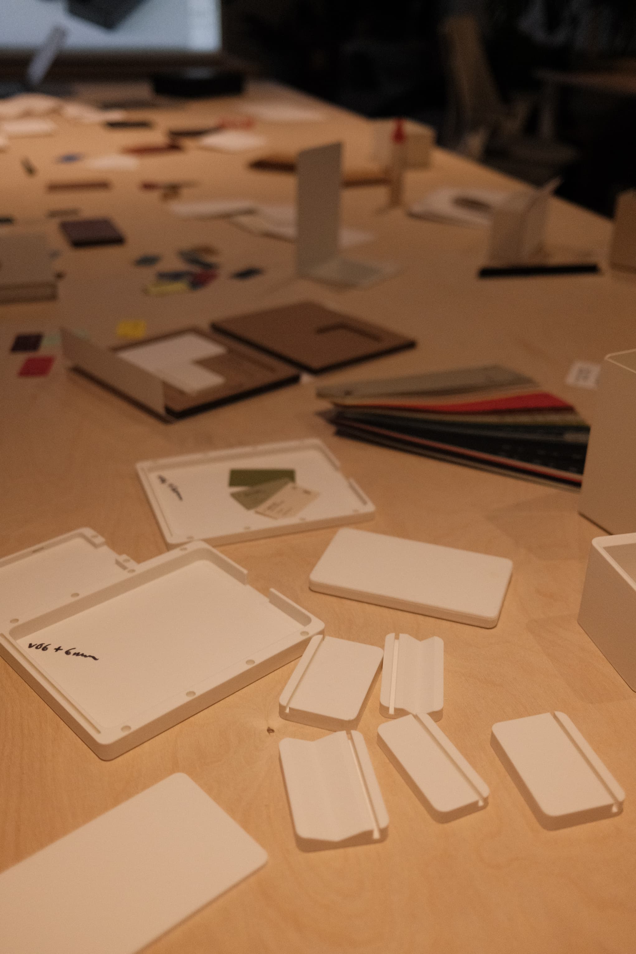 an image of a table with a bunch of cards and a laptop