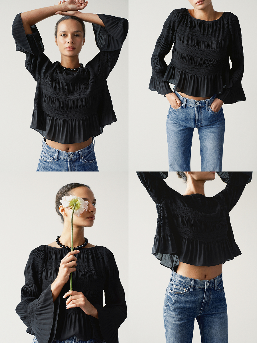 Shown in Black. A swingy floaty pleated top with a subtle cropped peplum, bell sleeve, and a ballerina neckline.