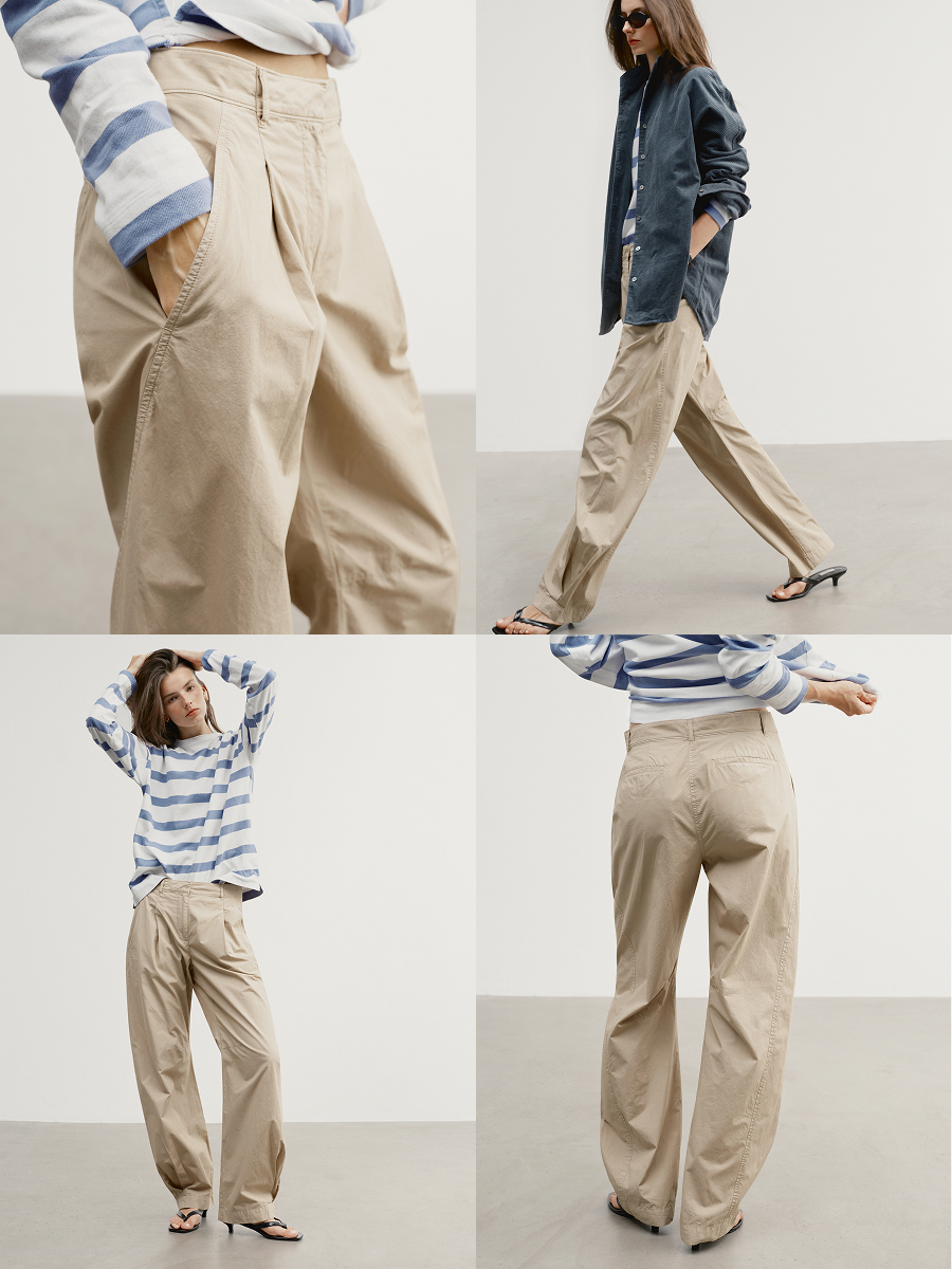 Shown in Cafe Au Lait. A pleated cotton trouser with soft volume and a slouchy attitude.