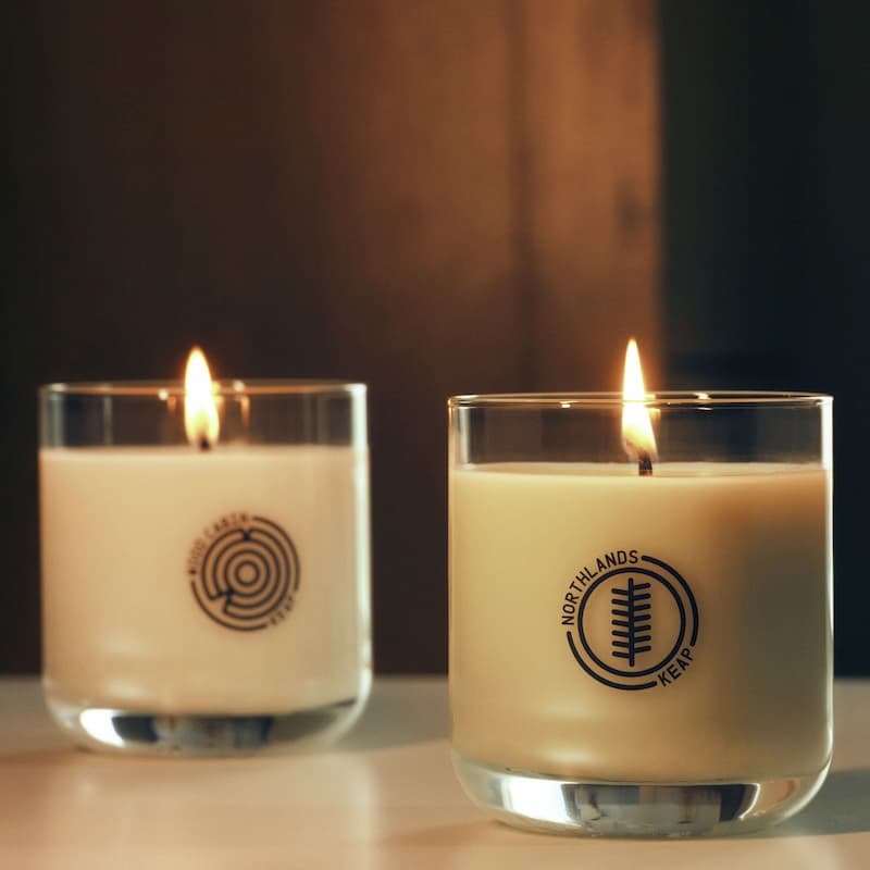 Wood Cabin candle and Northlands Duo displayed together