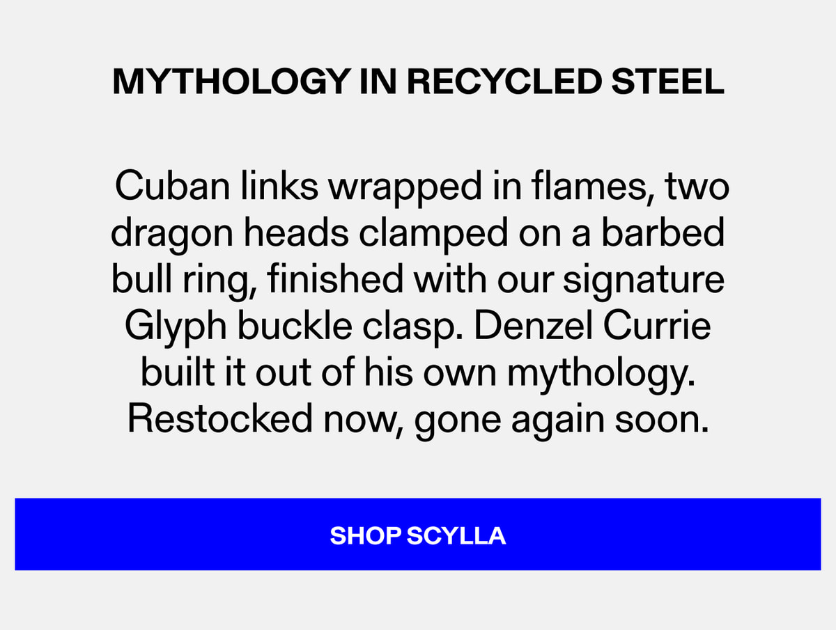 Mythology in Recycled Steel — Cuban links wrapped in flames, two dragon heads clamped on a barbed bull ring, finished with our signature Glyph buckle clasp. Denzel Currie built it out of his own mythology. Restocked now, gone again soon. Shop Scylla