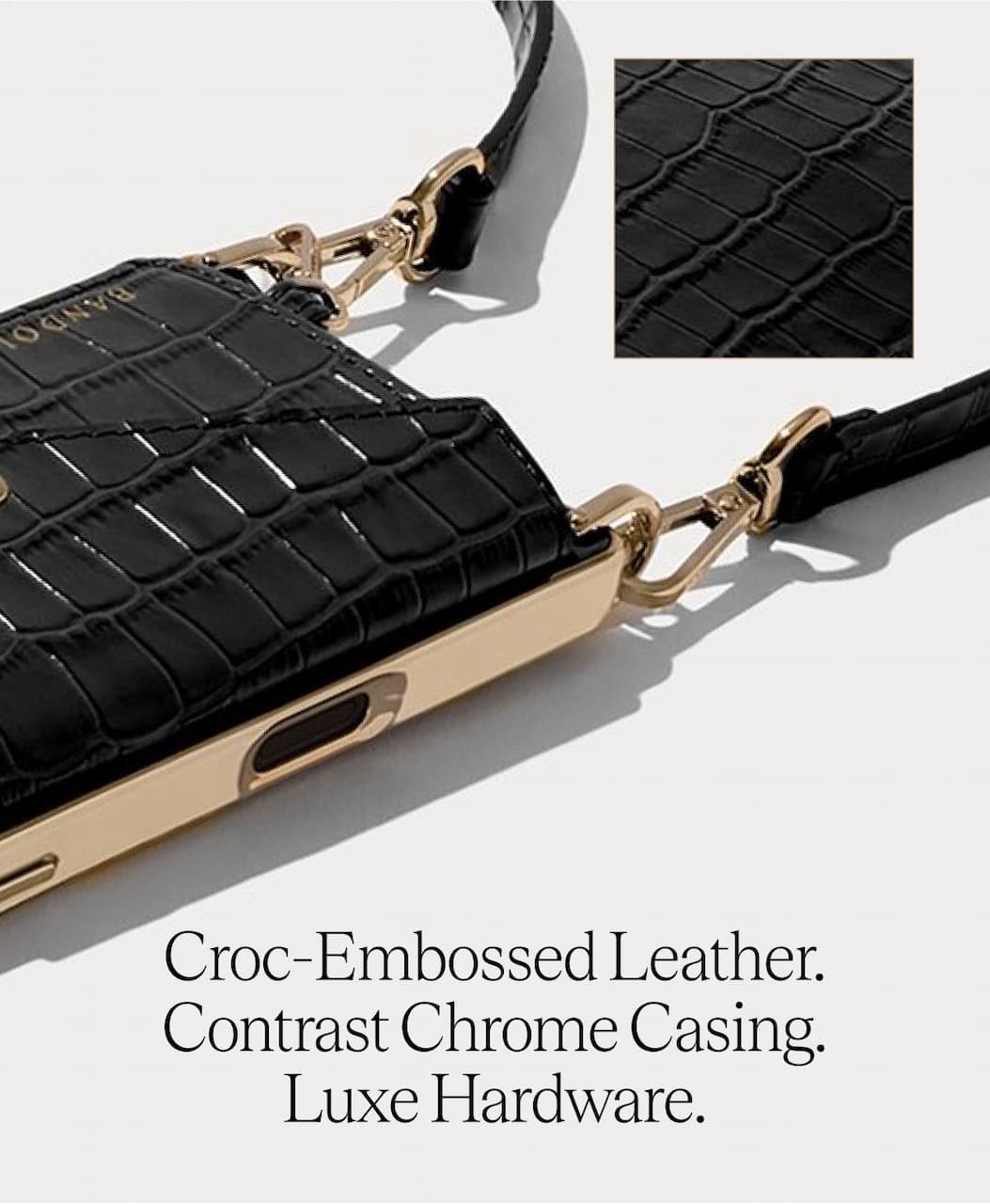 Croc-Embossed Leather. Contrast Cchrome Casing. Luxe Hardware.