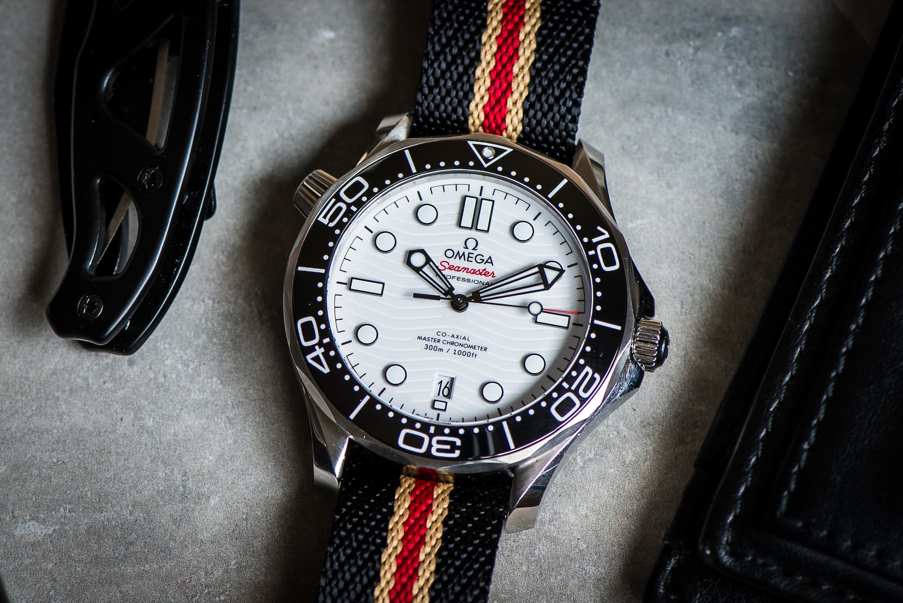 an image of a watch and other items on a table