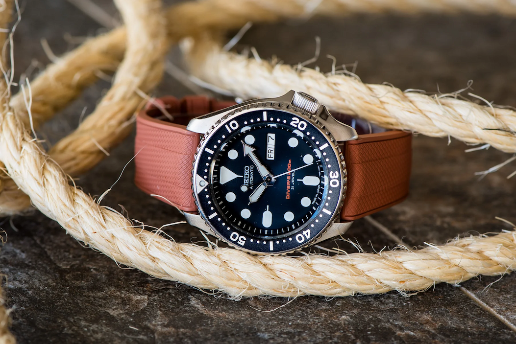 an image of a couple of watches sitting on top of a snow covered ground