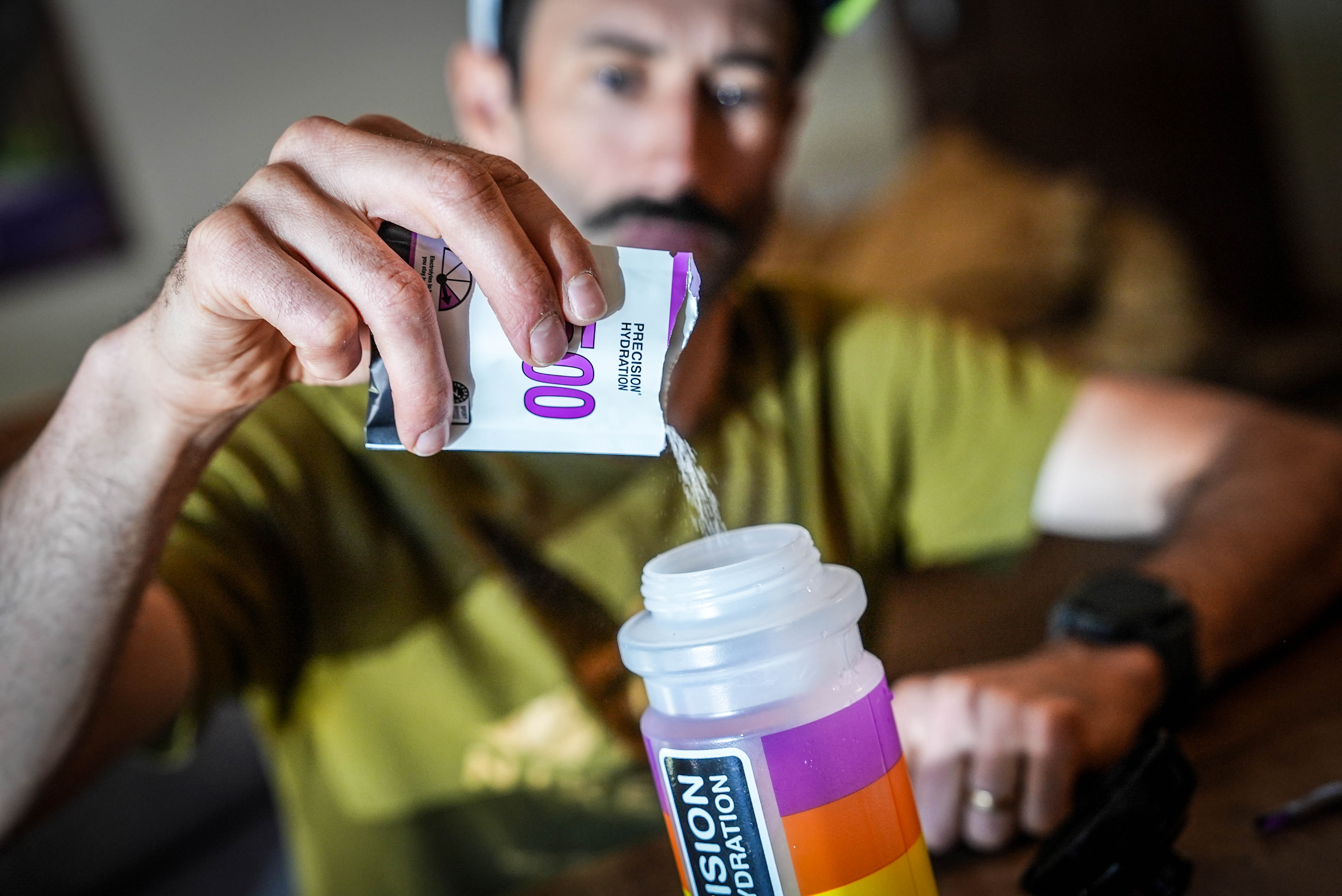 Tyler Green putting PH 1500 tablet in bottle