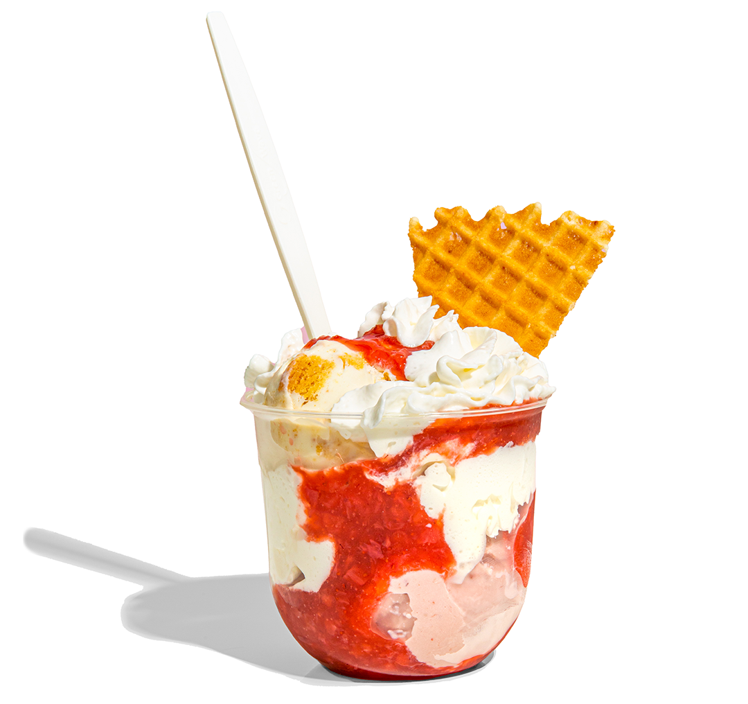 a strawberry shortcake ice cream parfait with waffle wedge