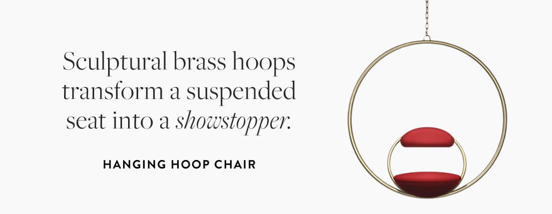 Hanging Hoop Chair: Sculptural brass hoops transform a suspended seat into a showstopper.
