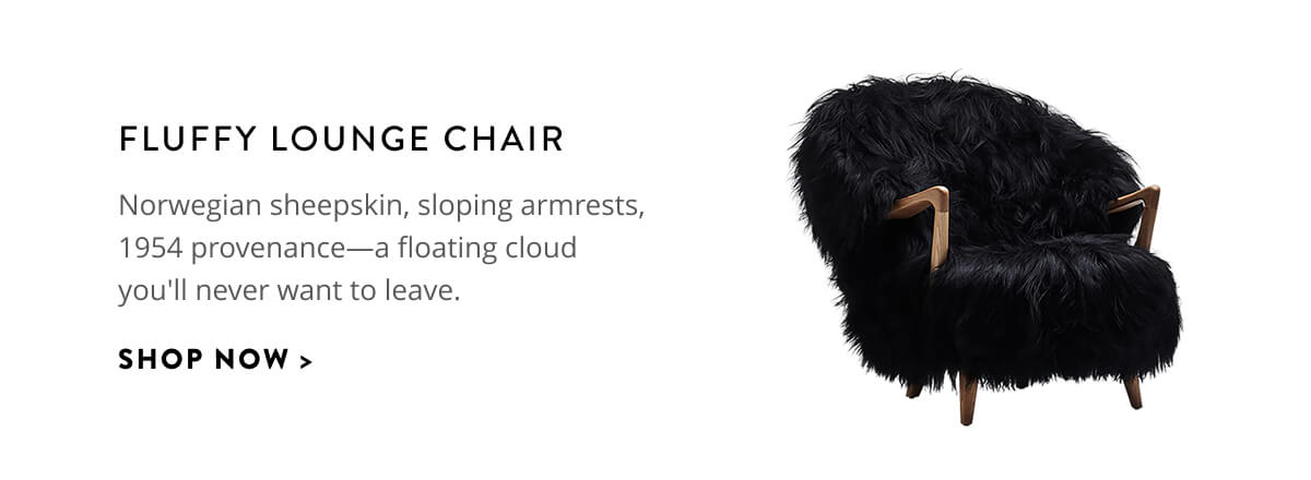 Fluffy Lounge Chair: Norwegian sheepskin, sloping armrests, 1954 provenance - a floating cloud you'll never want to leave. Shop now.