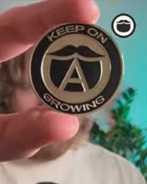 Eric holding a Beardbrand Challenge Coin