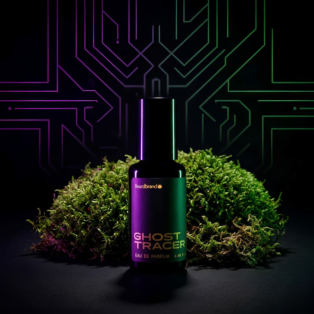 A bottle of Ghost Tracer Cologne on black backdrop with purple and neon lighting and moss behind the bottle.
