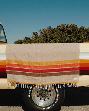 A sundream blanket on a vintage pickup truck
