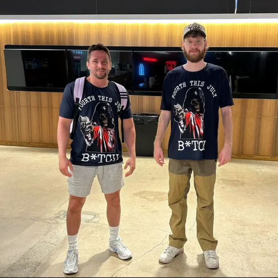 KB and Nick posing in merch