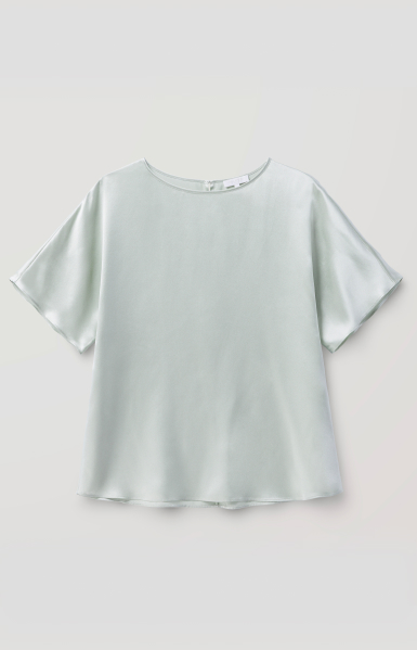 an image of a white top with a short sleeve and a bow