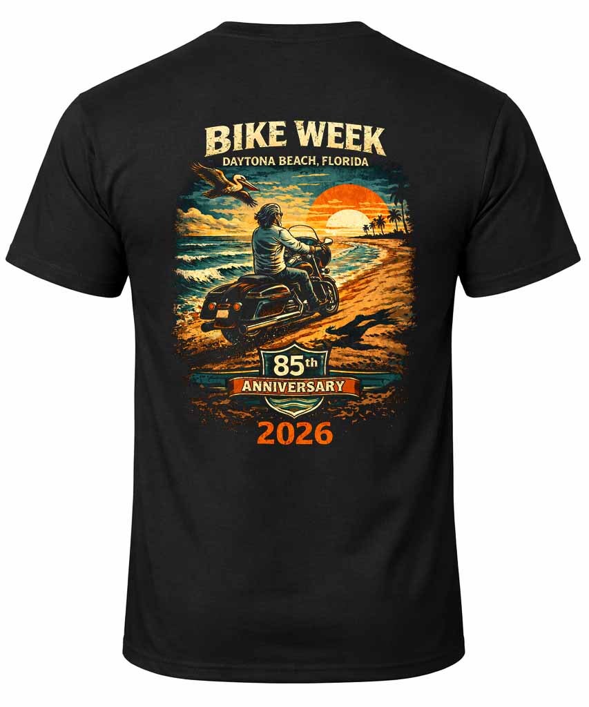 Rider on a Harley facing Mount Rushmore at golden hour, wearing the 2026 Sturgis Iron Bison tee