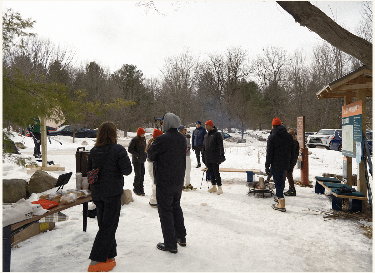 Friends and visitors enjoying hot chocolate and a warm fire.