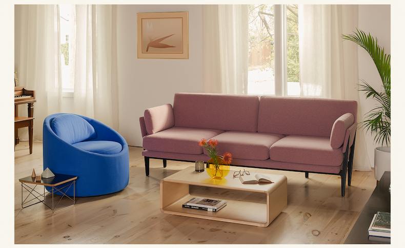 Pictured: The Gere Easy Chair in Cerulean, Sofa 2.0 in Mulberry, and Modular Table in Maple.