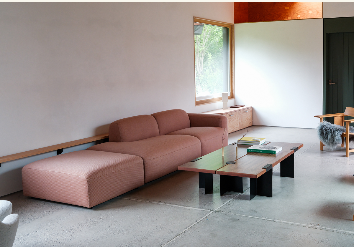 Pictured: The Lift Off Coffee Table in Black & Walnut and The Soft Serve Sectional in Safflower (Serpentine)