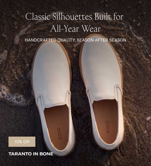 Classic Silhouettes Built for All-Year Wear HANDCRAFTED QUALITY, SEASON AFTER SEASON (Overhead image of off-white/bone leather slip-on shoes resting on dark wet beach sand at the shoreline) 10% OFF TARANTO IN BONE