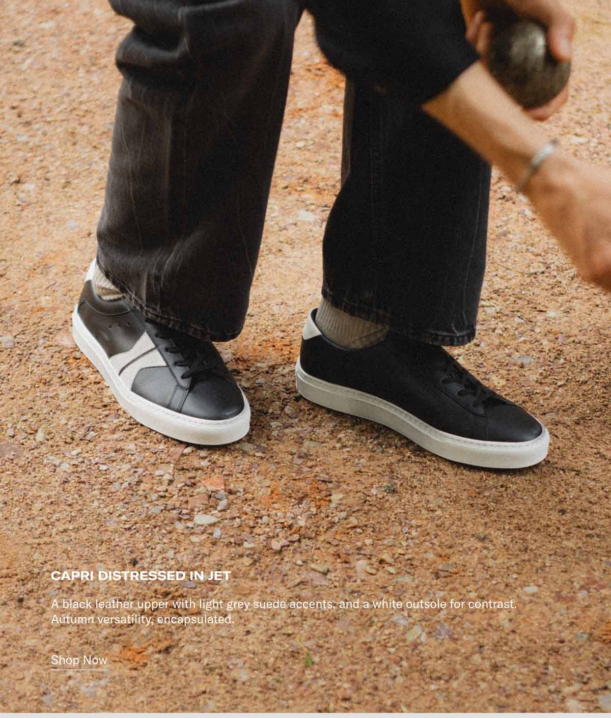 Capri Distressed in Jet A black leather upper with light grey suede accents, and a white outsole for contrast. Autumn versatility, encapsulated. Shop Now
