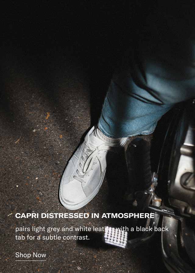 Capri Distressed in Atmosphere pairs light grey and white leather with a black back tab for a subtle contrast. Shop Now