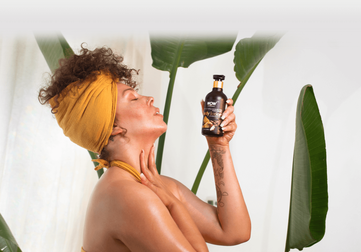 Woman applying WOW Skin Science Body Lotion on her skin